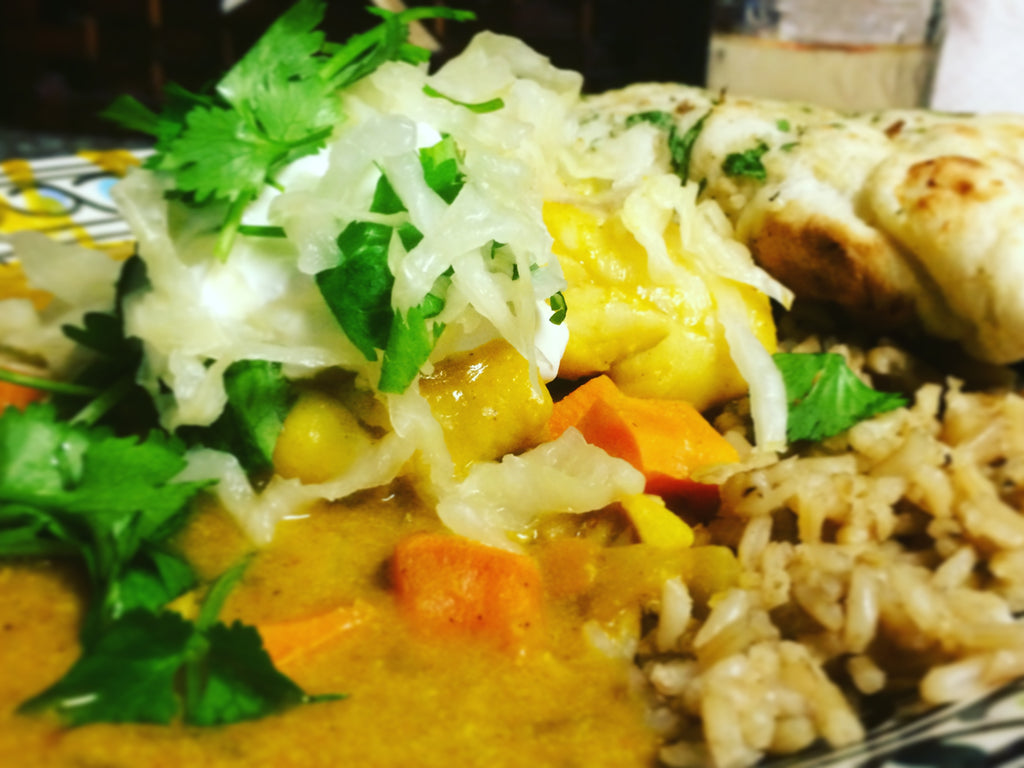 Pumpkin Coconut Curry w/ White Fish topped with Original OlyKraut