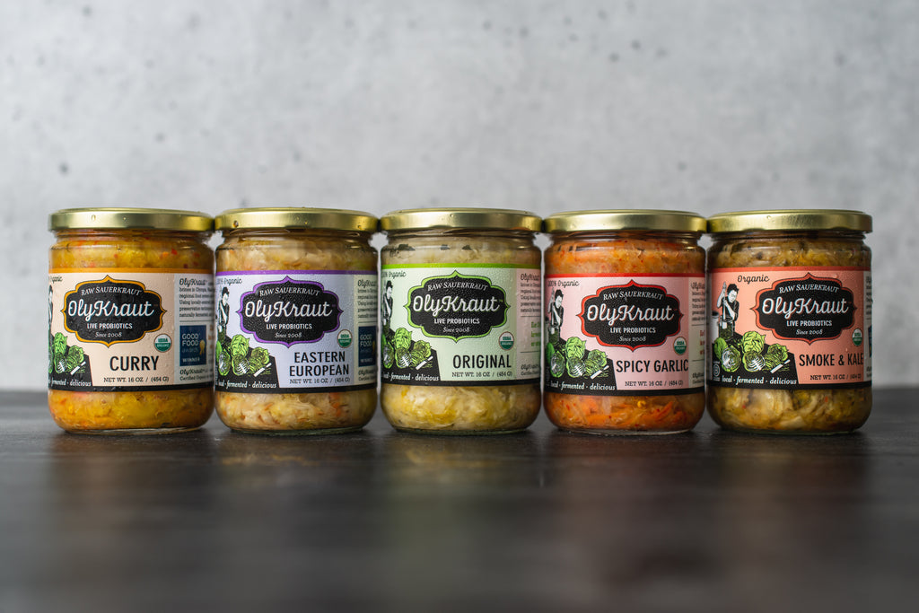 A lineup of jars of OlyKraut sauerkraut.