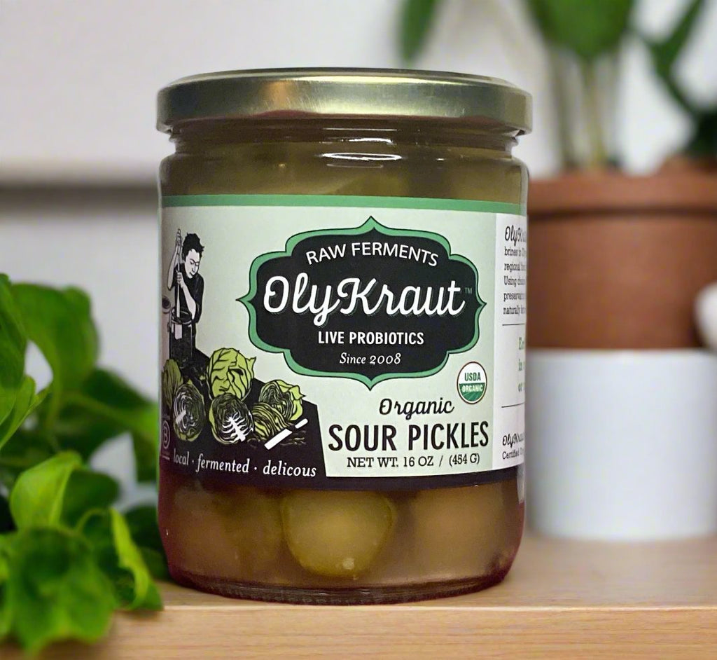 A glass jar filled with delicious fermented sour pickle chips