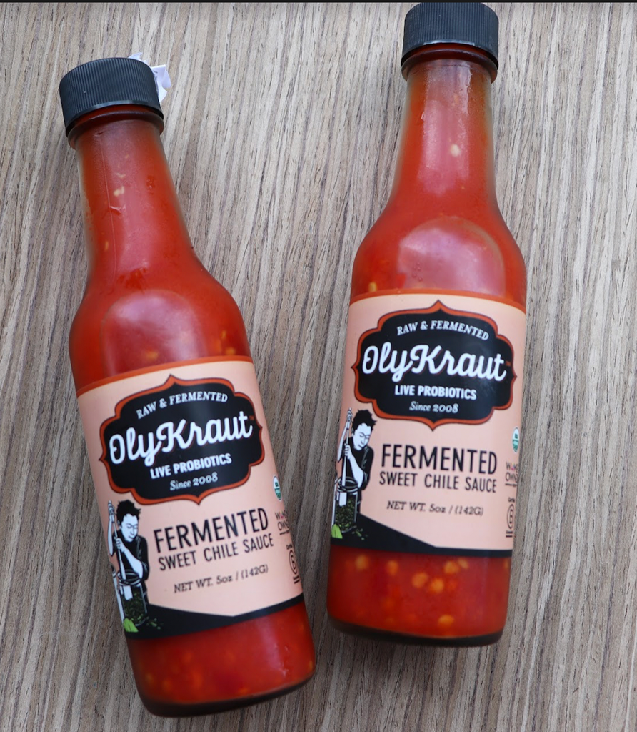 Two bottles of OlyKraut's Fermented Sweet Chile Sauce