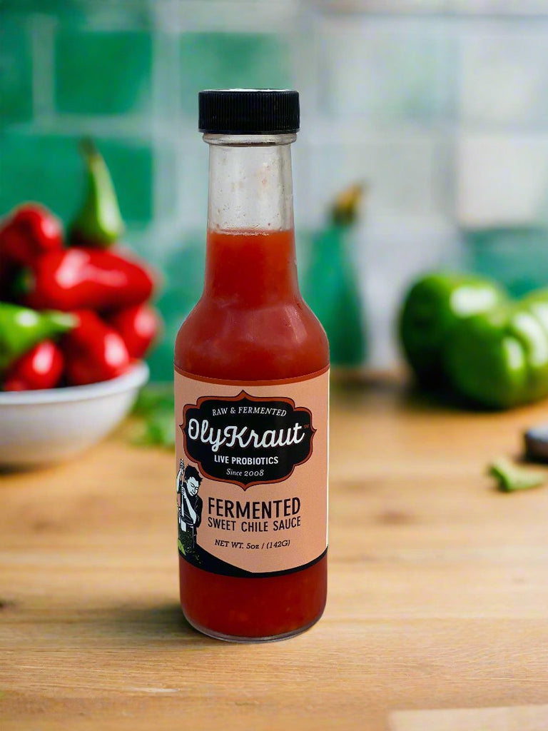 A bottle of hot sauce in a kitchen, it is fermented, probiotic and delicious.